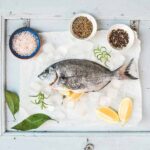 Sea bream fish with lemon, herbs
