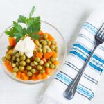 Vegetarian salad with canned peas, boiled carrots